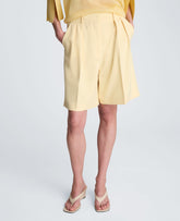 Kenneth Cole Vision Twill Fly Front High Rise Pleated Bermuda Short | PASTEL YELLOW